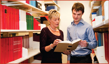 Photo: ALRC Librarian, Ms Carolyn Kearney and Legal Officer, Mr Jared Boorer in the Michael Kirby Library.